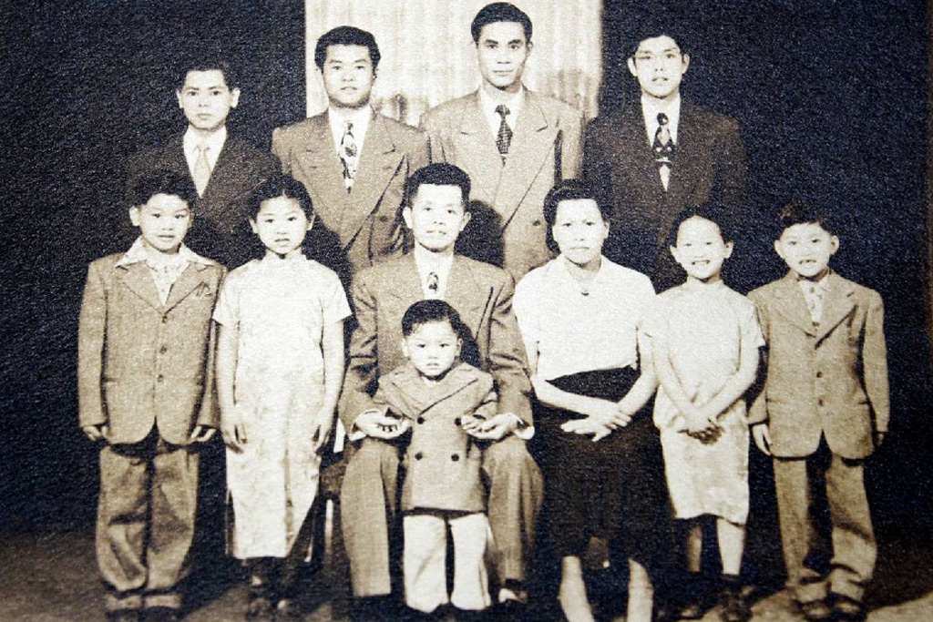 Raymond as a child, far left